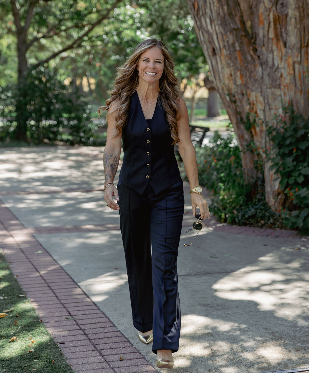 Chelsie walking outdoors during her portrait session